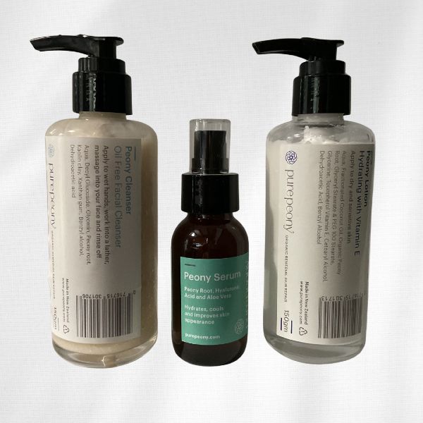 peony facial cleanser, peony toner serum and peony lotion all in glass jars for dry sensitive skin
