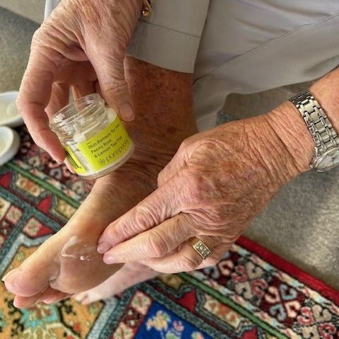 customer photo of applying best foot cream for sore feet