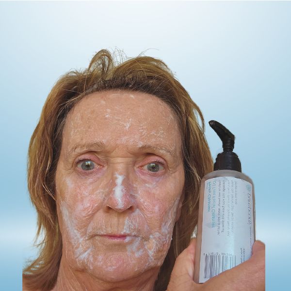 customer showing peony cleanser on face