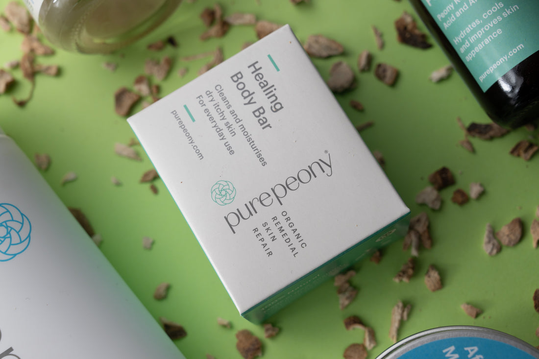 body bar on green background with scattered peony root