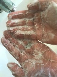 cleanser lathered up on hands