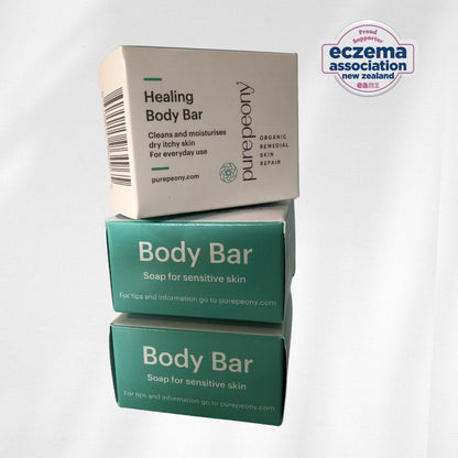 Three boxes of purepeony Healing Body Bar for sensitive skin and eczema on a white background