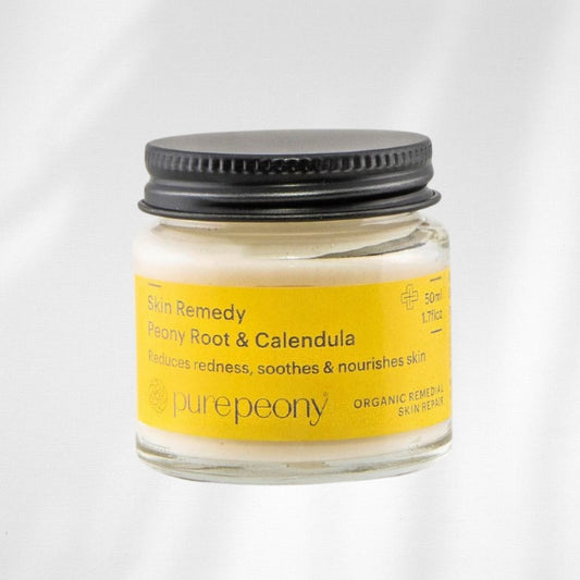 Jar of Skin Remedy with Peony Root & Calendula on a white background