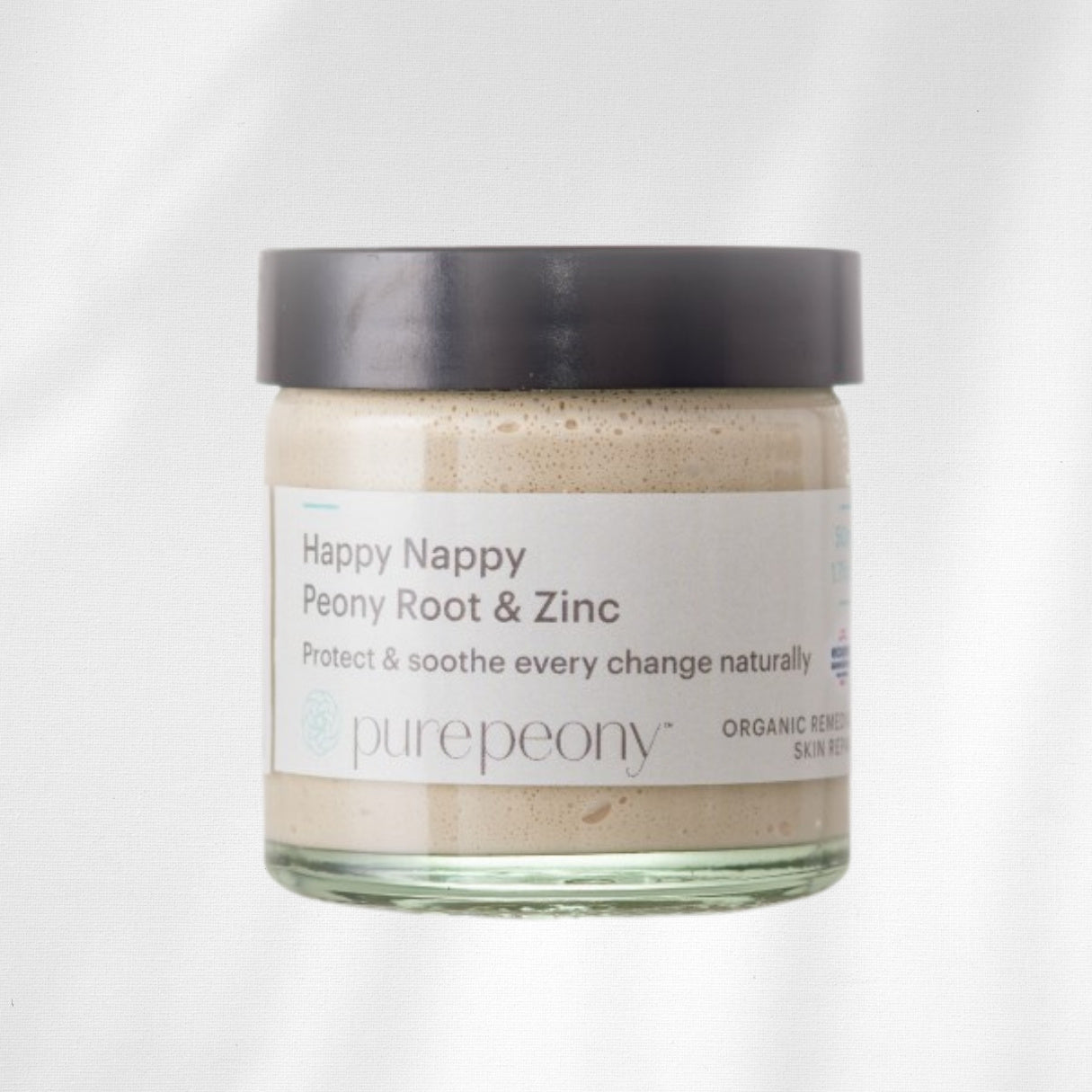 Jar of 'Happy Nappy Peony Root & Zinc' cream by purepeony on a white background