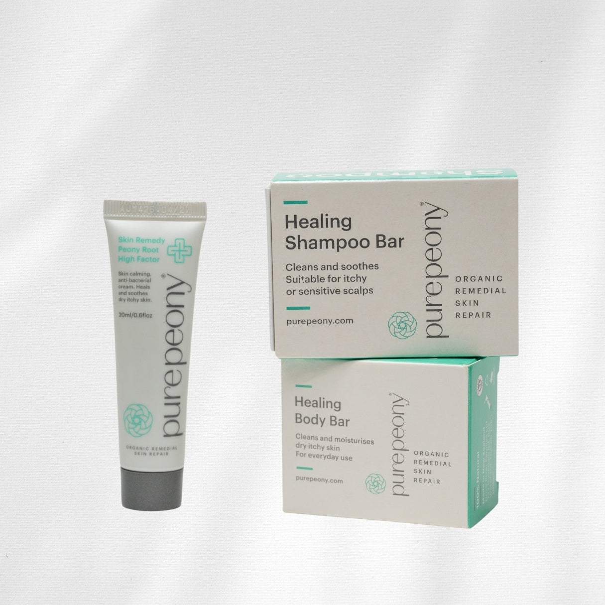 purepeony healing shampoo bar and body bar with packaging on a white background
